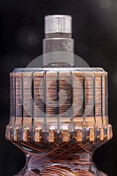 Copper commutator bar of the electric motor close up photo