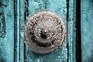 Copper decoration on the old door in Cuzco