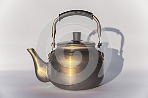 Copper desert tea pot, antique metal teapot isolated on white background, antique kettle, golden teapot, metal teapot, Chinese tea
