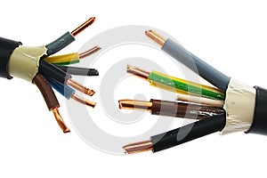 Copper electric power cable assemblies in PVC insulation jackets standing against each other, white background