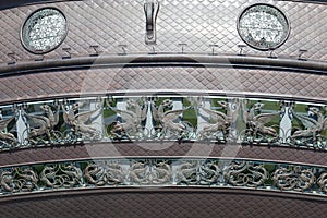 Copper figures of dragons and winged lions on the building