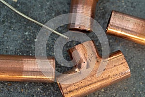 Copper fittings with a strand of sodder