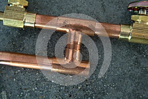 Copper fittings with a strand of sodder