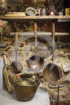 Copper ladles in old pharmacy workshop