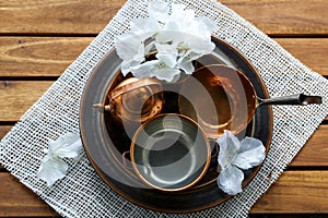 Copper old scratched vintage crockery kitchenware on the table