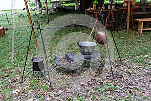 copper pan on fire with soup during a Middle Ages historic reenactment