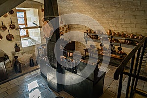 Copper pans and ustensils in an old kitchen in France
