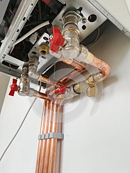 Copper pipes engineering in boiler-room. Heating system with copper pipes