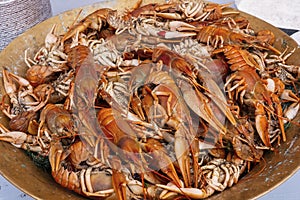 Copper plate with boiled red crawfishes