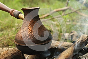 A copper pot with coffee