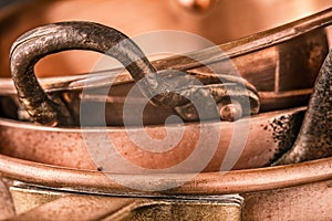 Copper pots and pans background close-up