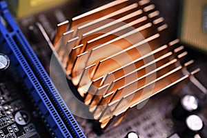 A copper radiator for cooling the chip on the computer board. Radio components.The computer's motherboard