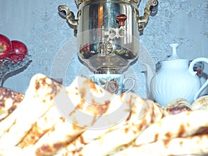 Copper samovar. Traditional russian blini. Pancakes. Pancake week. Maslenitsa is an Eastern Slavic traditional holiday