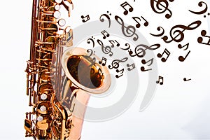 Copper saxophone with black notes and white background