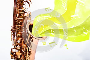 Copper saxophone with notes with yellow background