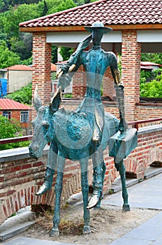 Copper statue of a man on the donkey in Sighnaghi