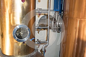 Copper still alembic inside distillery