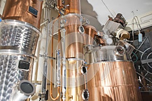 Copper still alembic inside distillery