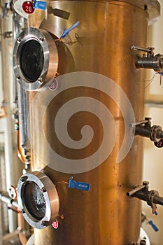 Copper still alembic inside distillery