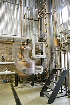 Copper still in craft bourbon distillery
