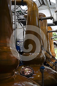 copper stills in a whisky distillery