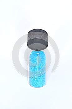 Copper sulfate crystals in a glass container
