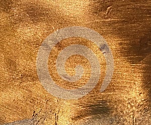 Copper texture background. Bronze texture. Beautiful bright color of metal. Shine, gradient and overflow of shades.