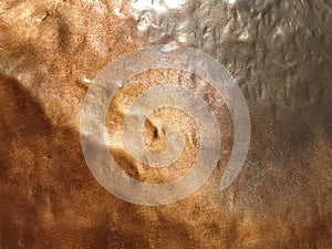 Copper texture background. Bronze texture. Dents on metal surface