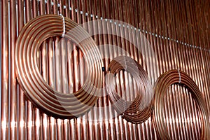 Copper tubes rolled into a ring and straight