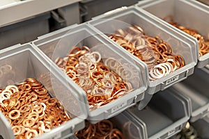 Copper washers in plastic boxes
