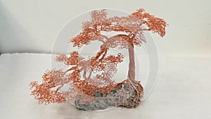 Copper wire bonsai tree on a granite stone