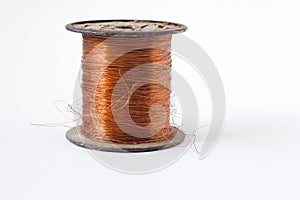 Copper wire on spool, isolated on white backgrounds, with clipping paths on white background . photo