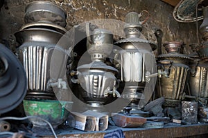 Coppersmith workshop and hand made copper things, Lahich, Azerbaijan. Interior of coppersmith workshop in the village.