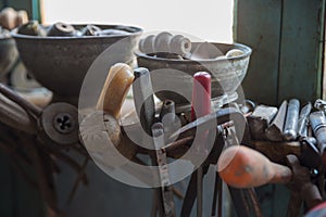 Coppersmith workshop and hand made copper things, Lahich, Azerbaijan. Interior of coppersmith workshop in the village.