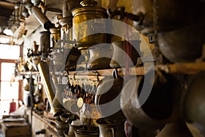 Coppersmith workshop and hand made copper things, Lahich, Azerbaijan. Interior of coppersmith workshop in the village.