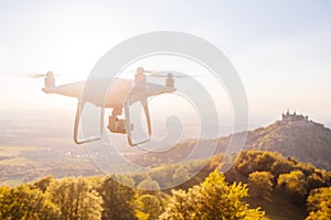 copter drone flying at sunset