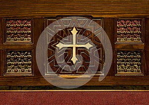 Coptic cross on a wooden pew inside the Cavern Church known as Abu Serga in Coptic Christian Cairo, Egypt.