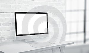 Coputer display on office desk with isolated screen in white for app or web page presentation mockup