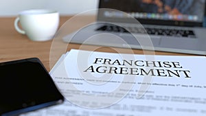 Copy of franchise agreement on the desk. 3D rendering