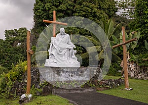 Copy of Michaelangelo`s Pieta outside Saint Benedict`s Painted Church on the Big Island, Hawaii. photo