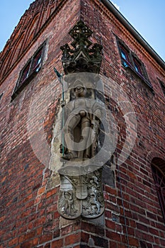 A copy of the original 1507 statue of Saint Maurice at the corner of the medieval building of the City Hall.