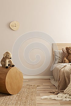 Copy space on empty wall of natural kid`s bedroom