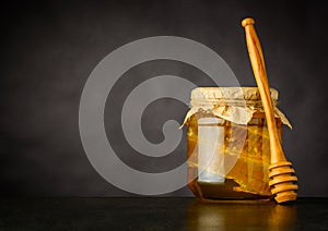 Copy Space of Honey Jar with Dripper photo