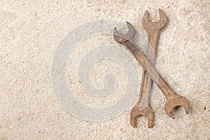 Copy space two old rusted spanner wrenches Mechanic tool on grey concrete background