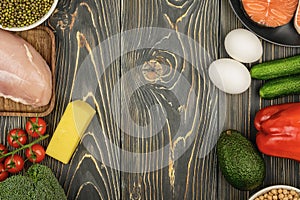 Copy space on a wooden textured background. Along the edges of healthy foods, diet food. Healthy eating concept with