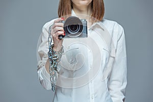 Copyright. The camera is chained to the photographer& x27;s hand. The concept of protecting the photographer from theft