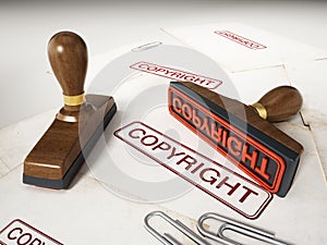 Copyright stamp standing on documents. 3D illustration