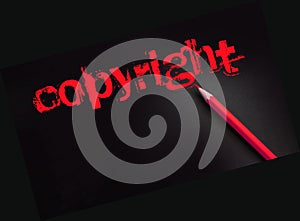 Copyright word in yelow on black and pencil besides. Trademark Identity Owner Legal Concept