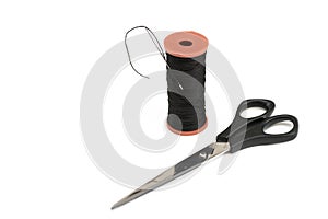 Copyspace frame with sewing scissors and thread bobbin with needle