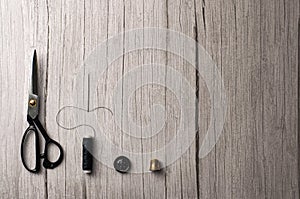 Copyspace frame with sewing tools on wooden table